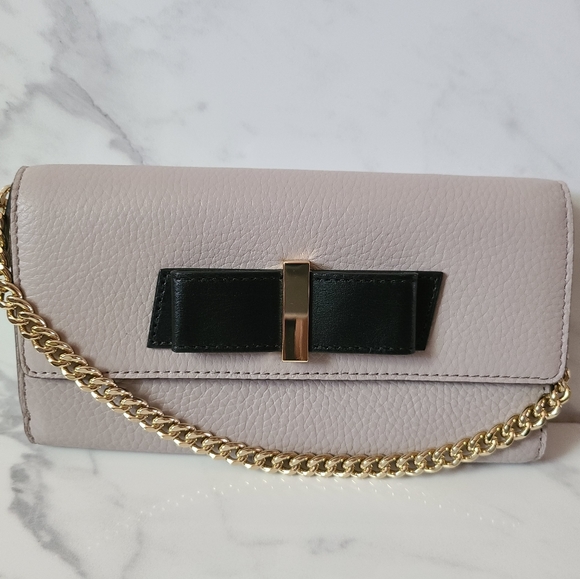 kate spade Handbags - NWOT Kate Spade Clutch/wallet cream with black bow